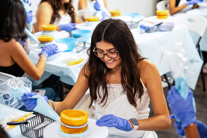 Cake decorating party moment